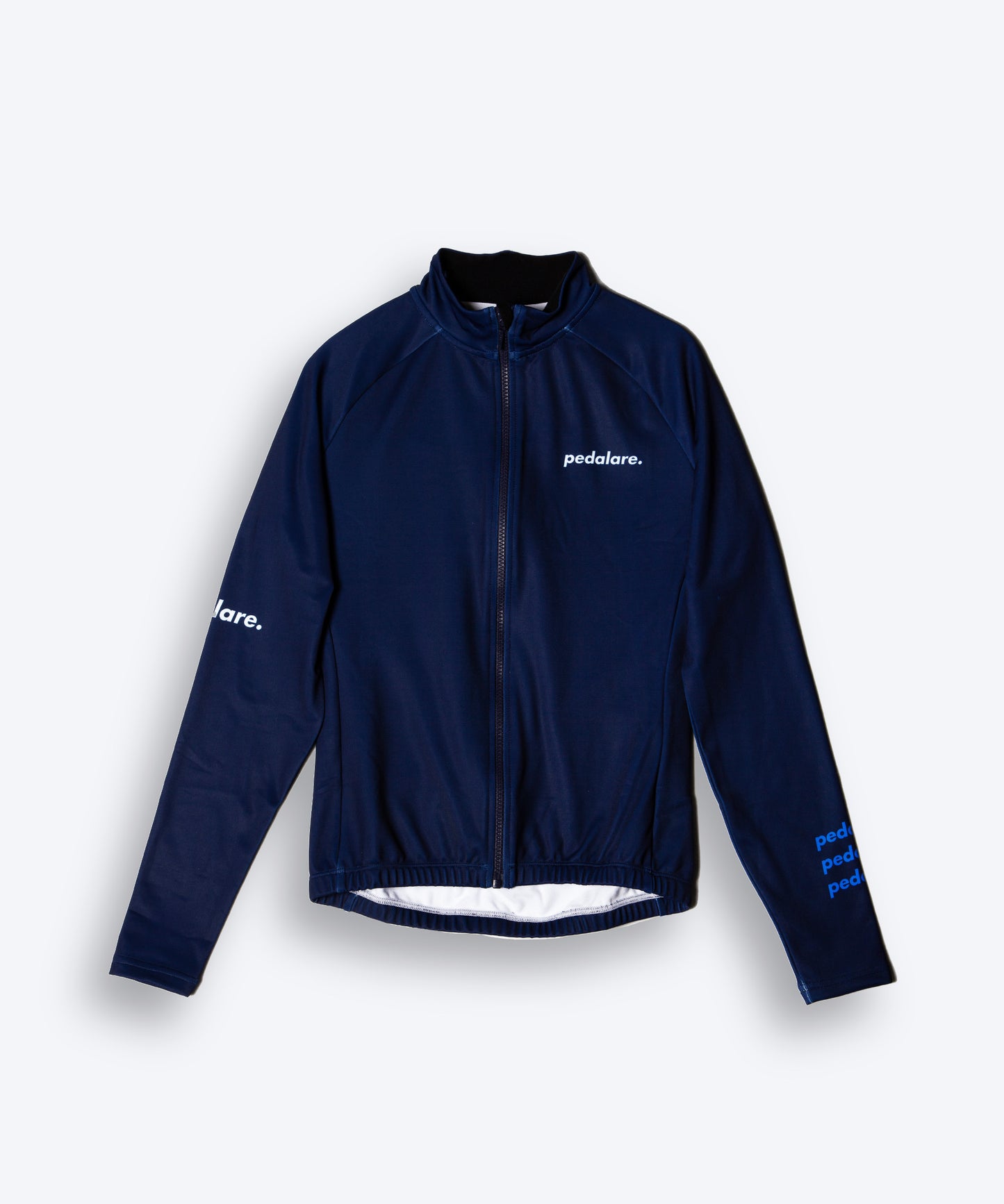 Male cyclist modelling Pedalare’s navy winter long sleeve cycling jersey, paired with black bib shorts. Side profile studio shot highlighting the jersey’s thermal fabric, streamlined fit, and subtle branding. Designed by Perth cycling brand Pedalare for cool-weather performance and style. Men’s winter cycling jersey ideal for road cyclists seeking aero cycling gear and premium cycling apparel.