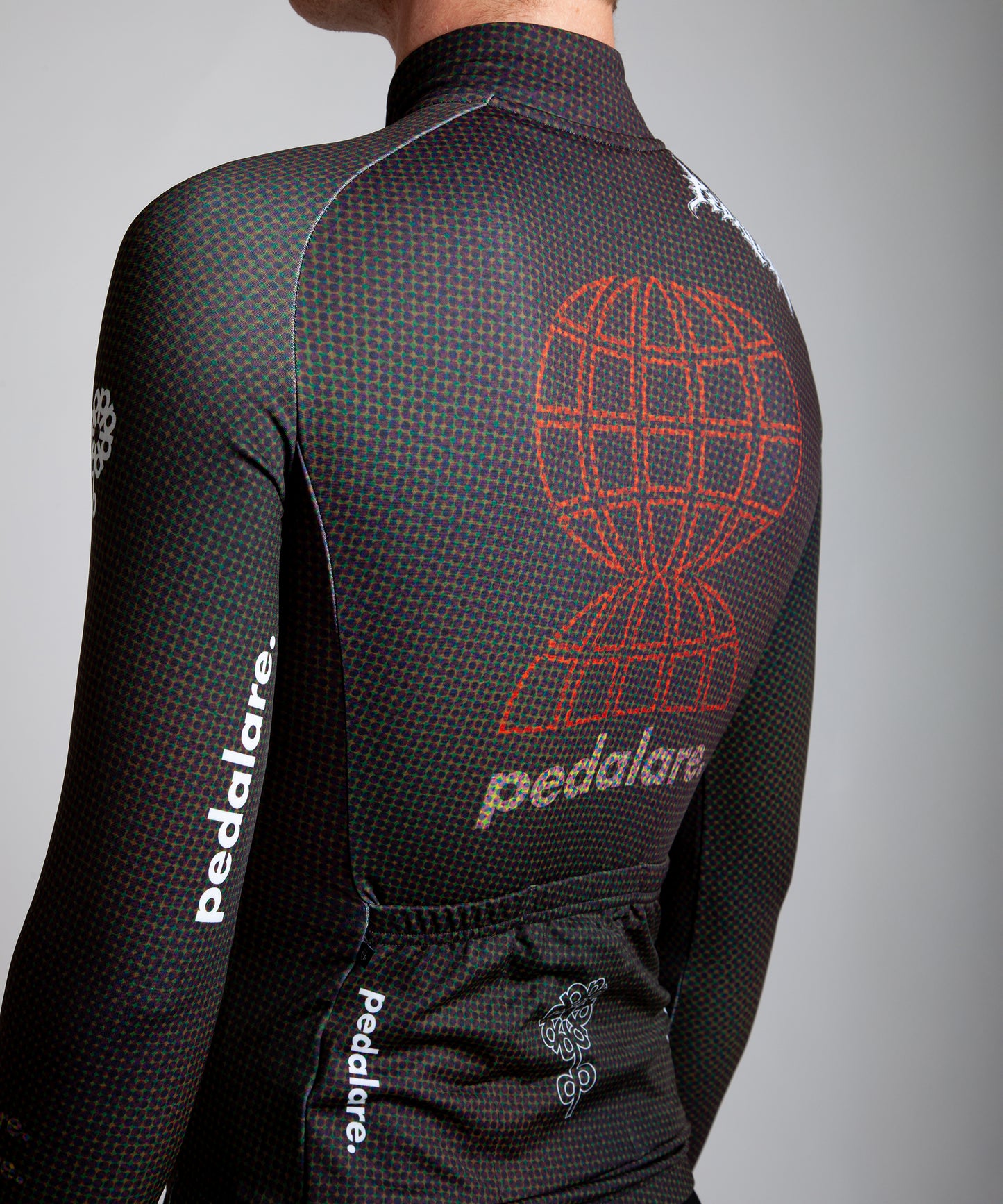 Male cyclist modelling Pedalare’s navy winter long sleeve cycling jersey, paired with black bib shorts. Side profile studio shot highlighting the jersey’s thermal fabric, streamlined fit, and subtle branding. Designed by Perth cycling brand Pedalare for cool-weather performance and style. Men’s winter cycling jersey ideal for road cyclists seeking aero cycling gear and premium cycling apparel.