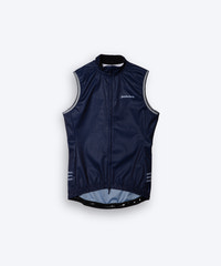 Male men’s cyclist wearing Pedalare’s high-performance navy, blue cycling vest, layered over a navy long sleeve jersey and black bib shorts. Side profile studio shot showcasing the vest’s aerodynamic fit and premium detailing. Lightweight, windproof men’s cycling vest ideal for cool weather rides. Designed by Perth cycling brand Pedalare for performance, comfort, and style. Aero cycling gear for dedicated road cyclists.