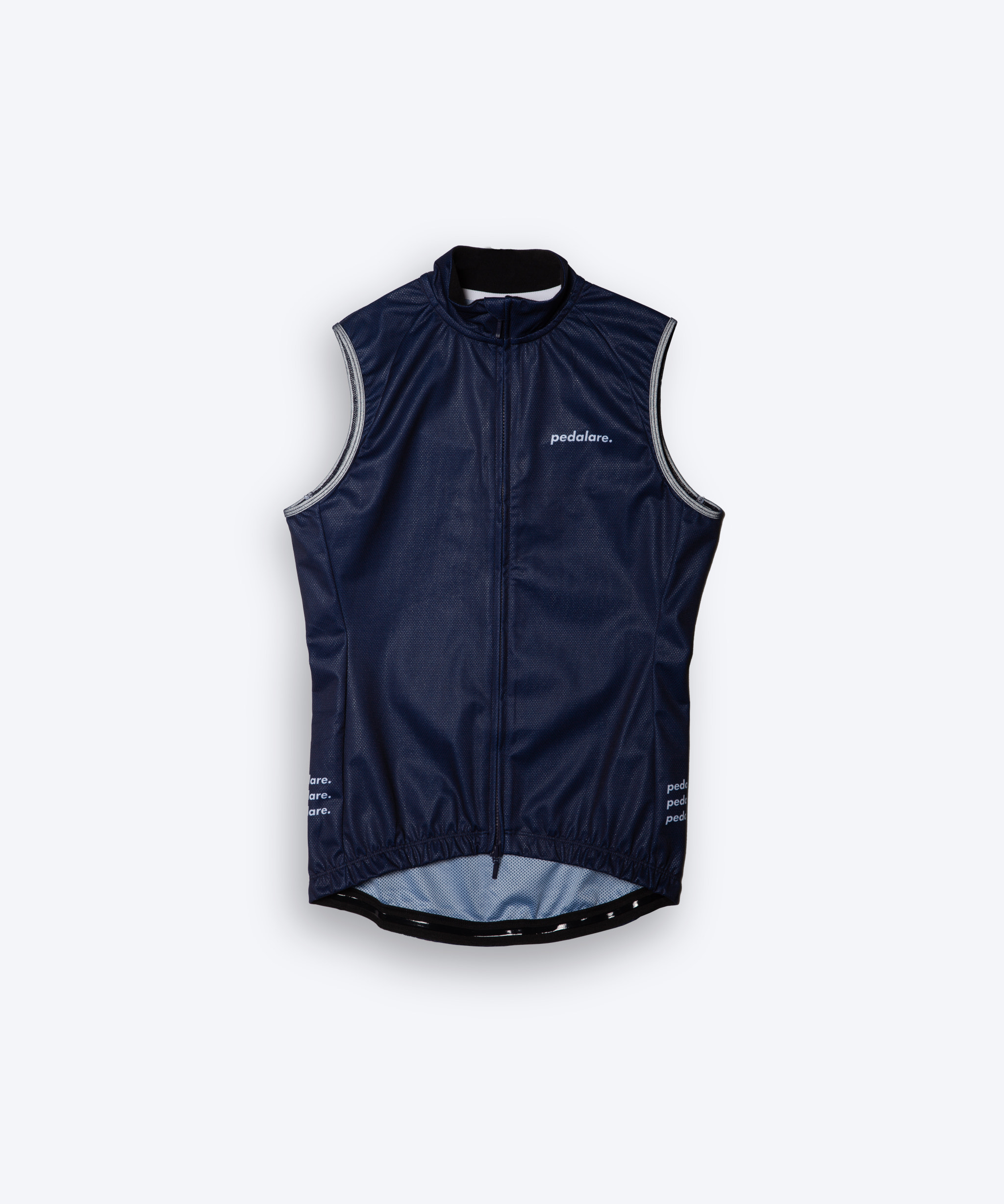 Male men’s cyclist wearing Pedalare’s high-performance navy, blue cycling vest, layered over a navy long sleeve jersey and black bib shorts. Side profile studio shot showcasing the vest’s aerodynamic fit and premium detailing. Lightweight, windproof men’s cycling vest ideal for cool weather rides. Designed by Perth cycling brand Pedalare for performance, comfort, and style. Aero cycling gear for dedicated road cyclists.