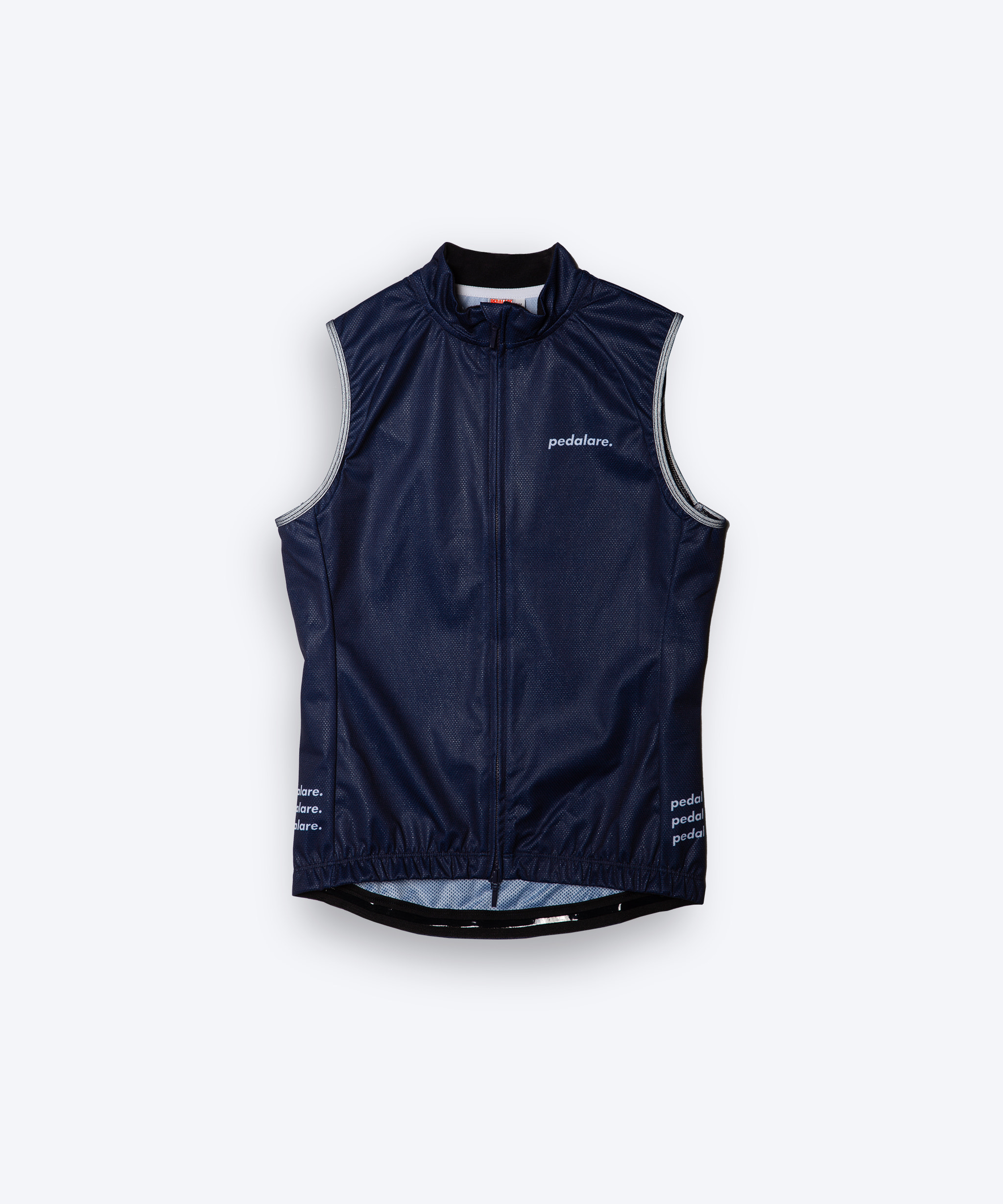 Female cyclist wearing Pedalare’s high-performance navy, blue cycling vest, layered over a navy long sleeve jersey and black bib shorts. Side profile studio shot showcasing the vest’s aerodynamic fit and premium detailing. Lightweight, windproof men’s cycling vest ideal for cool weather rides. Designed by Perth cycling brand Pedalare for performance, comfort, and style. Aero cycling gear for dedicated road cyclists.
